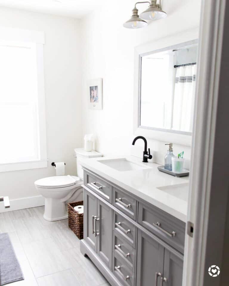 Minimalistic Bathroom with a White-Framed Mirror