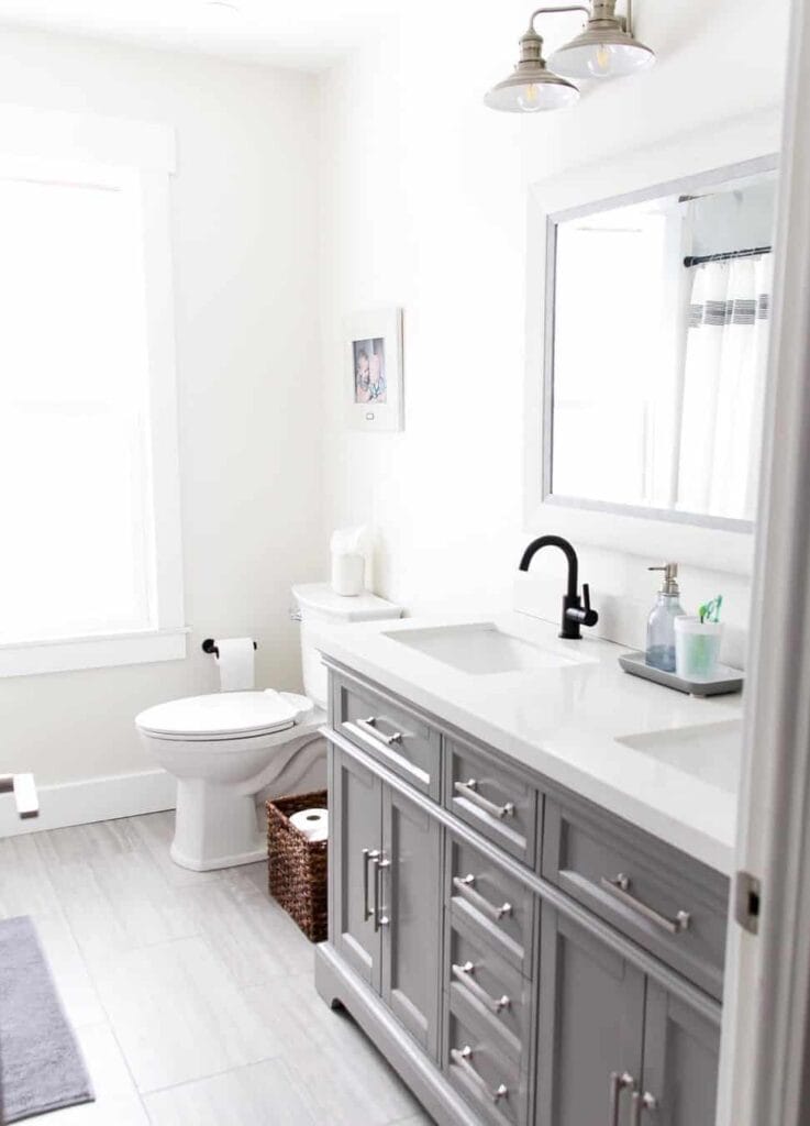 Minimalistic Bathroom with a White-Framed Mirror