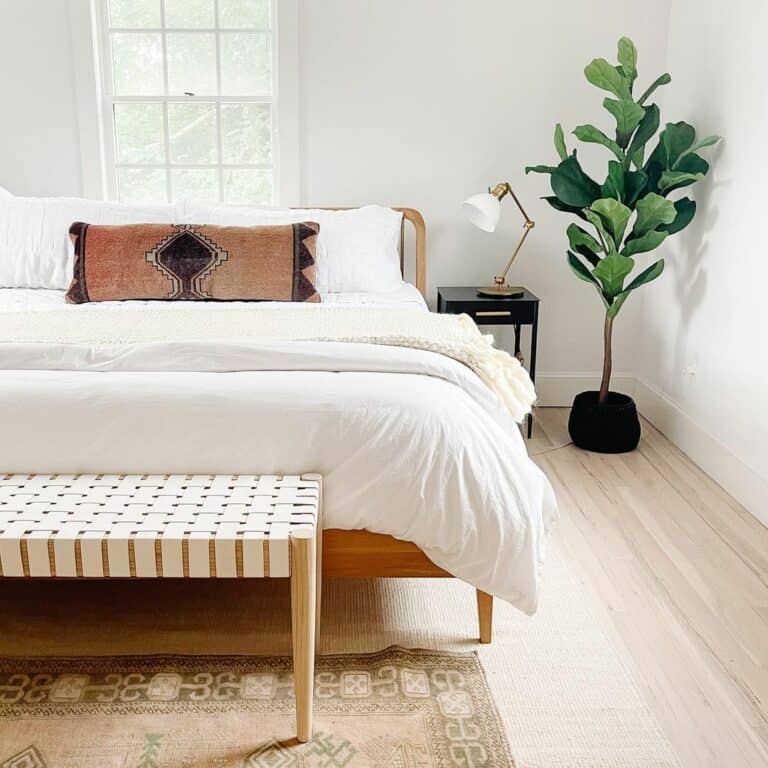 Modern Bed With White Bedding in Front of Window