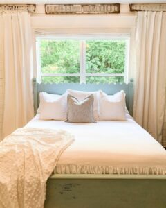 Modern Bed in Front of Window With Neutral Bedding