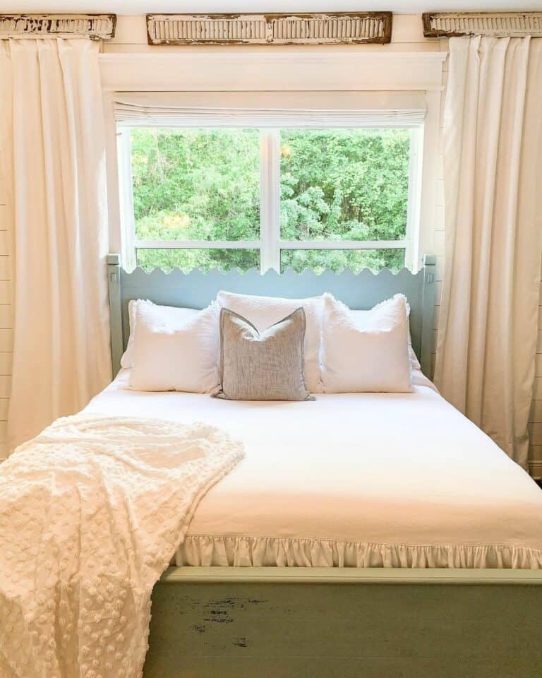 Modern Bed in Front of Window With Neutral Bedding