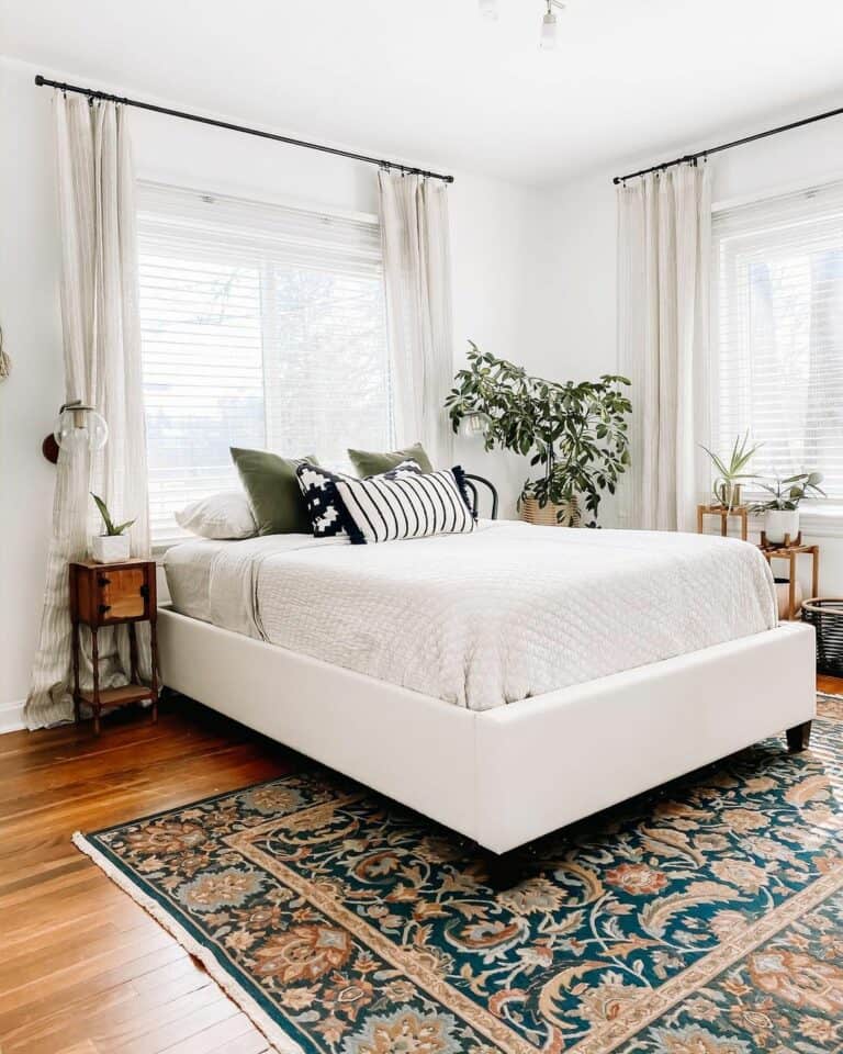 Modern Bed in Front of Windows With Beige Curtains