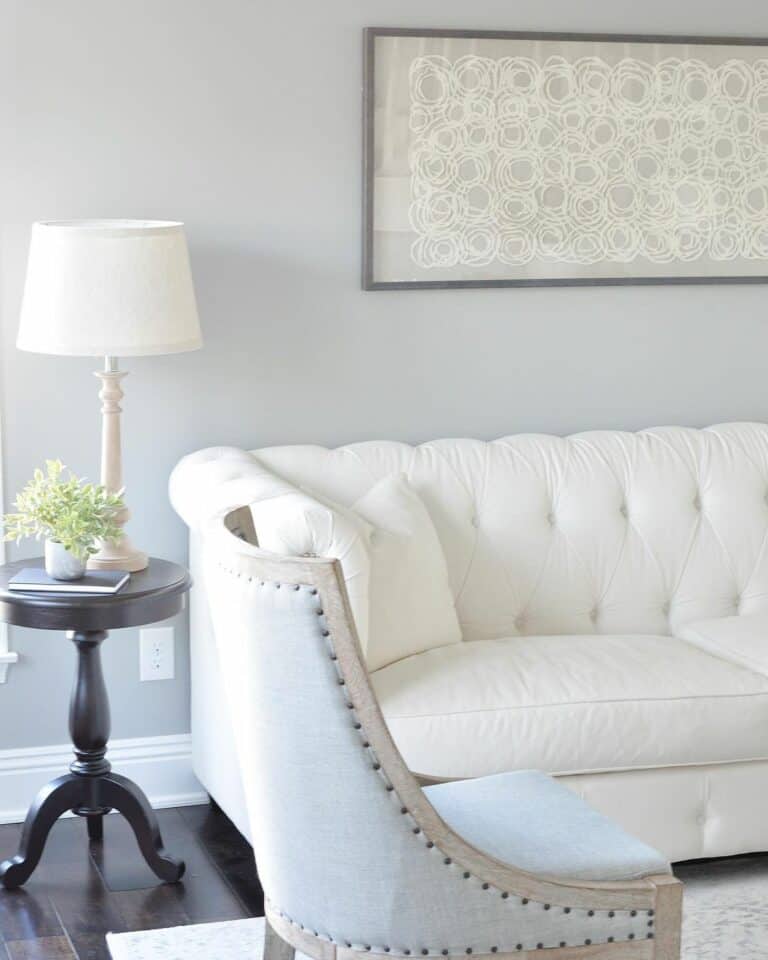 Modern Black End Table and a Tufted White Couch