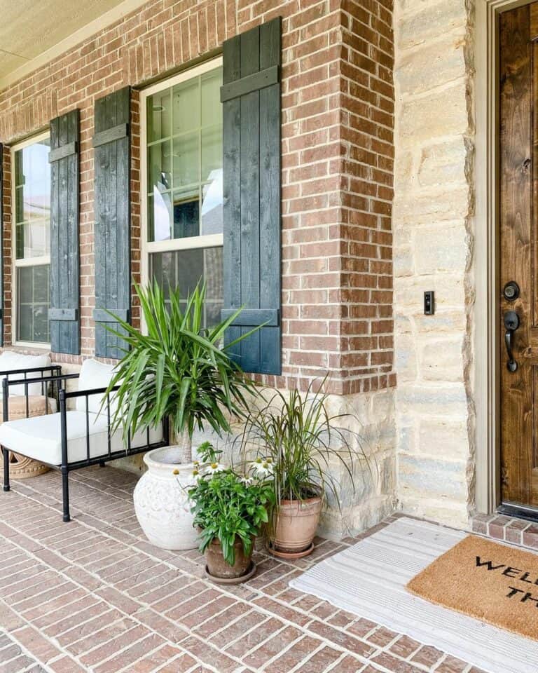 Modern Brick Front Porch with Black Wood Shutters