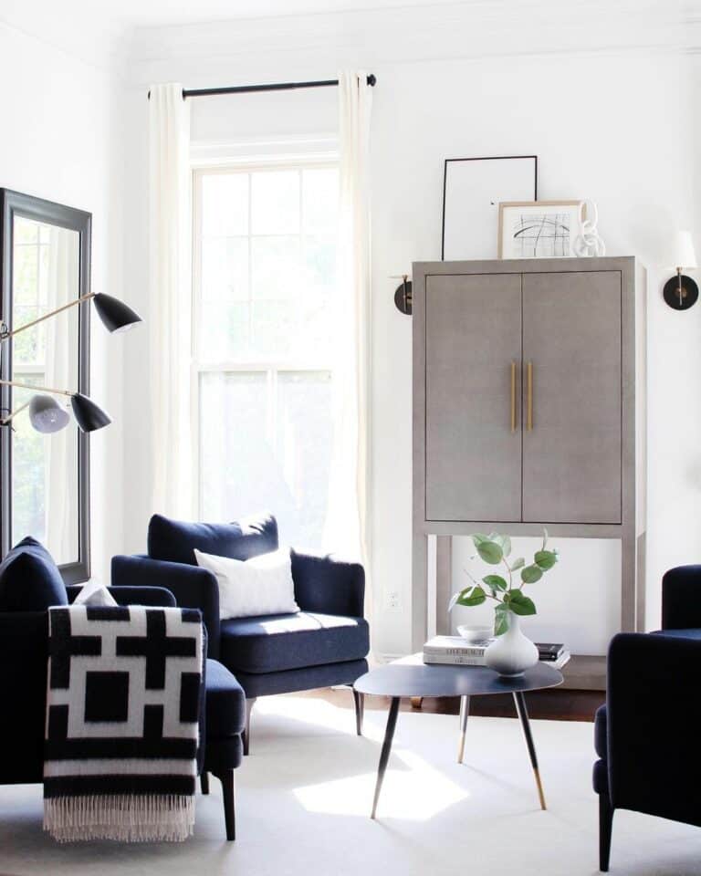 Modern Coffee Table Between Dark Blue Armchairs Soul & Lane