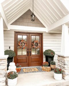 Modern Farmhouse Doors Decorated with Seasonal Greenery