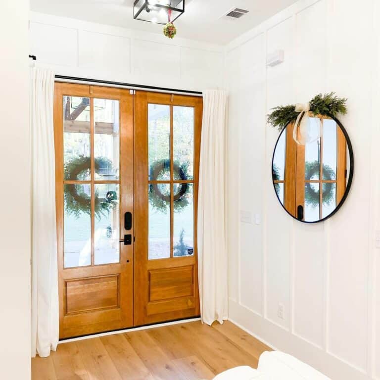 Modern Farmhouse Entryway With Black Chandelier