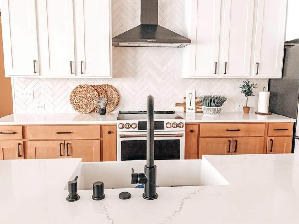 Modern Farmhouse Kitchen With Herringbone White Tile Backsplash