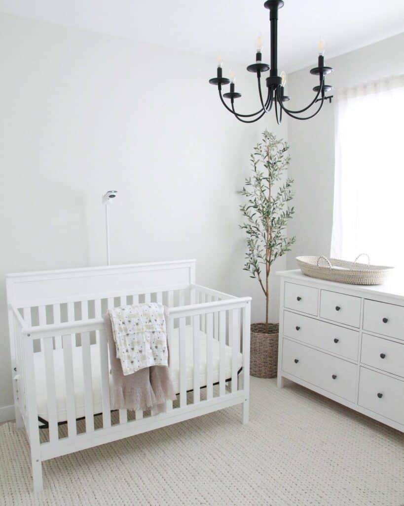 Modern Farmhouse Nursery With Black Chandelier