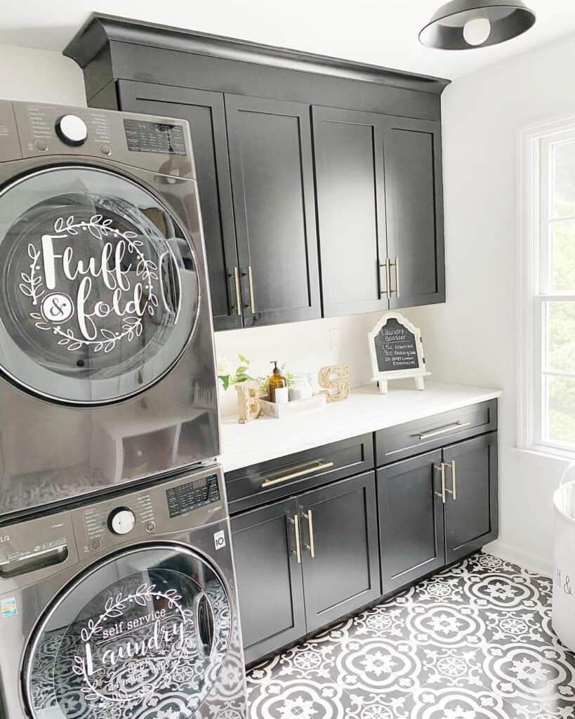 Monochromatic Laundry Room With Stacked Washing Machines