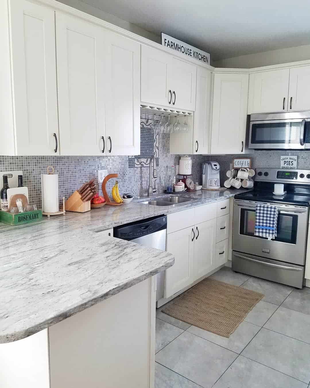 white kitchen cabinets with mosaic backsplash