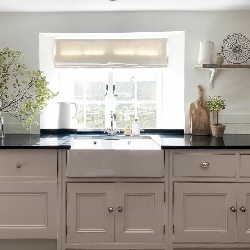 Off-White Cabinets with Black Countertop