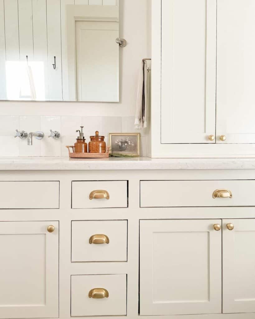 Off-White Inset Cabinets with Gold Hardware