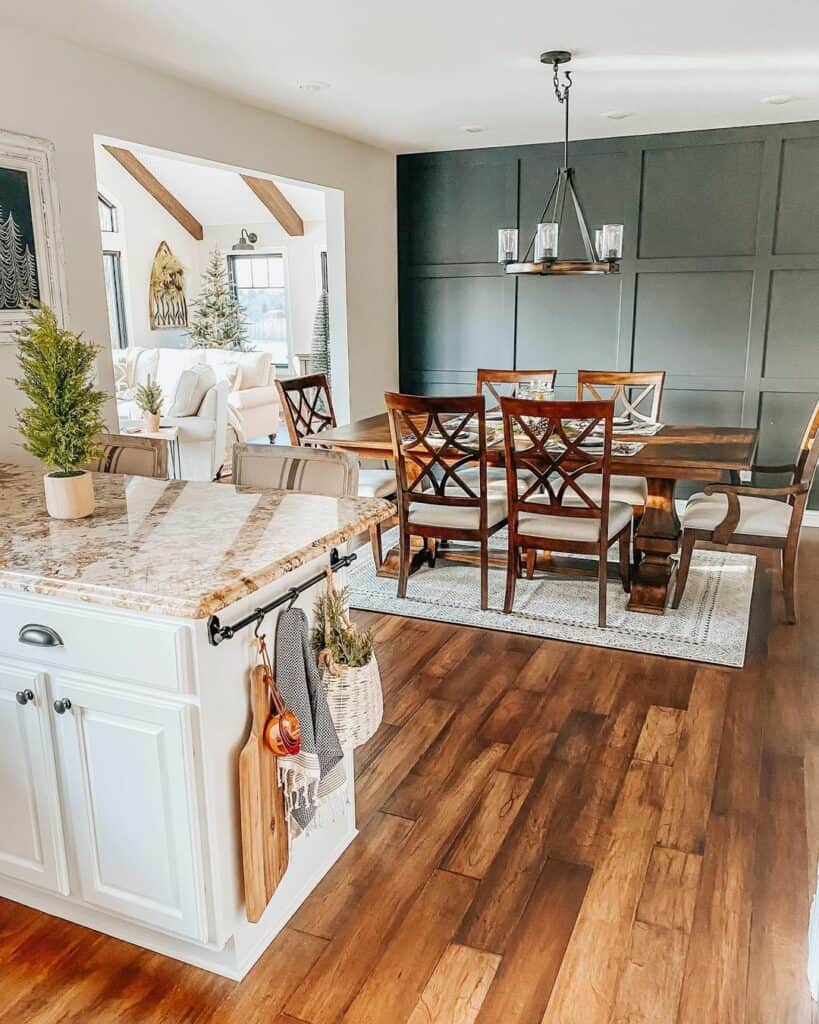 Open Concept Dining Room and Kitchen With Green Accent Wall