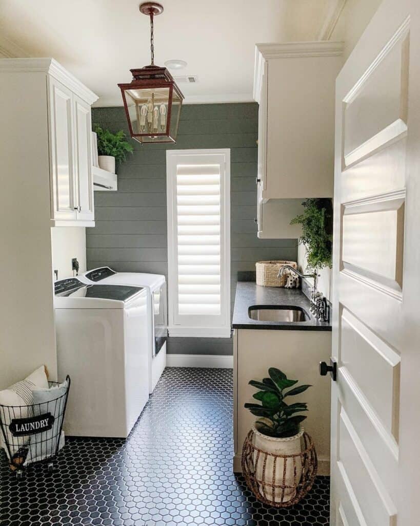 Organized Laundry Room with Black Tile Floor