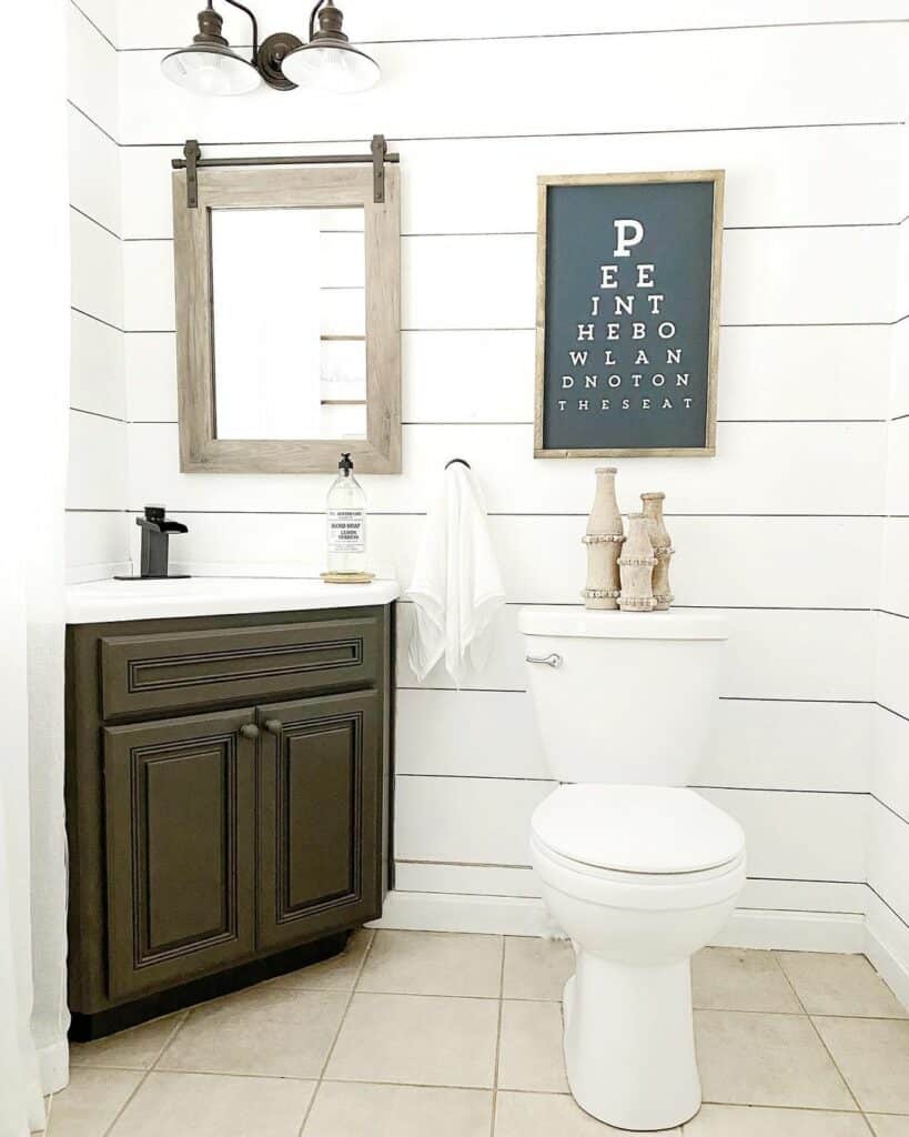 Powder Room With White and Wooden Elements