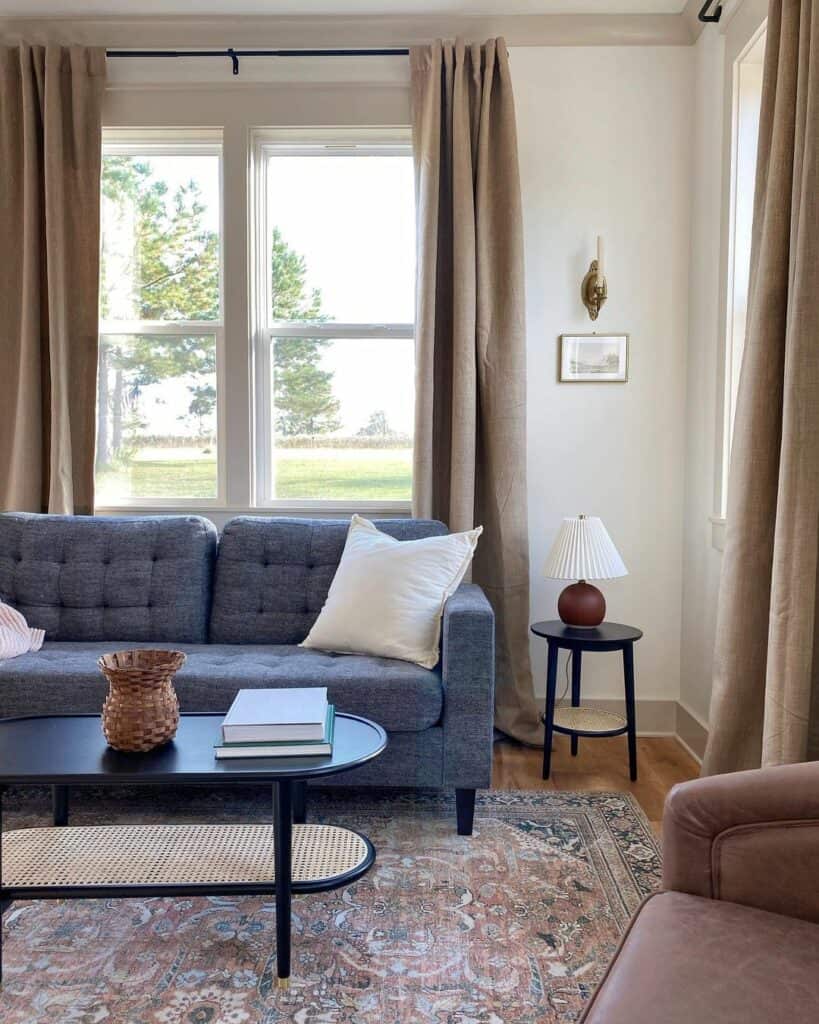 Red Lamp on a Round Black End Table With Storage