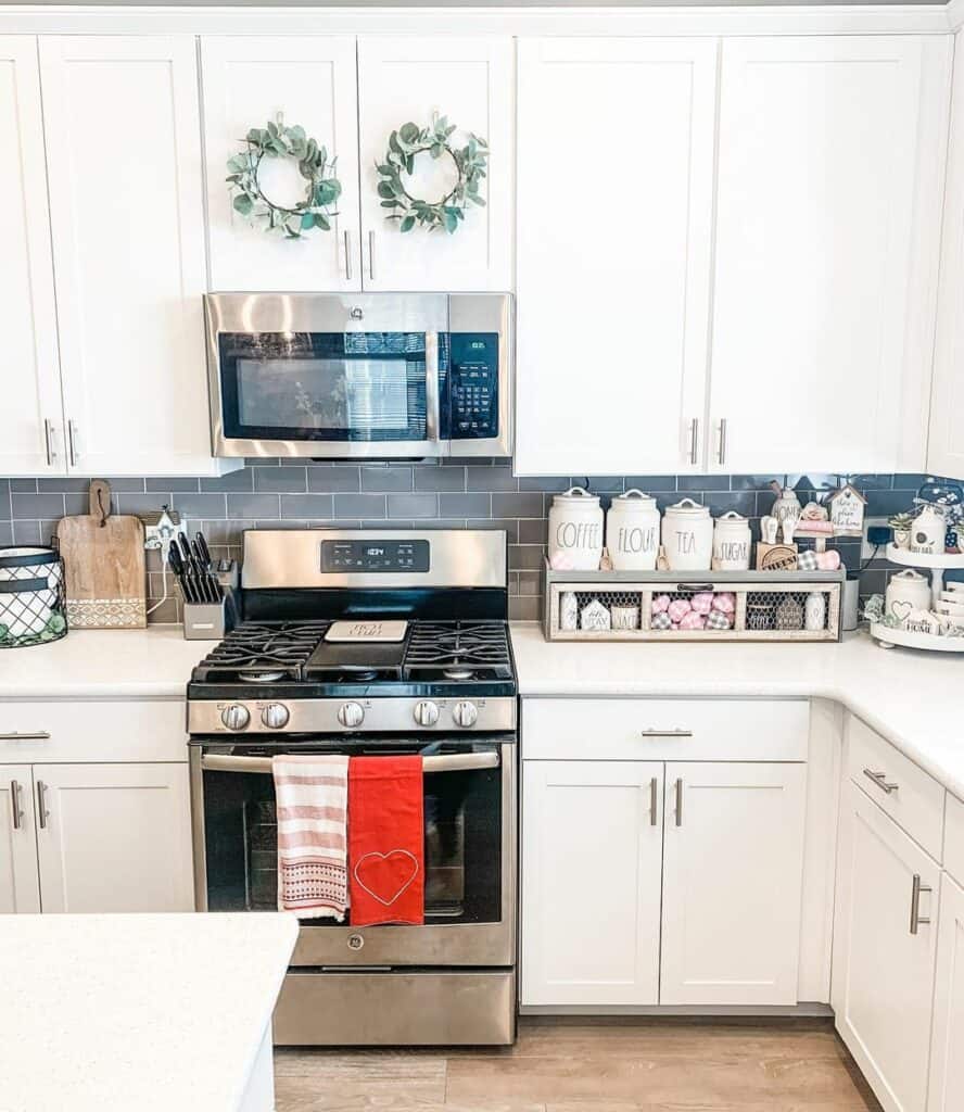 Red and White Towels and a Grey Tile Backsplash