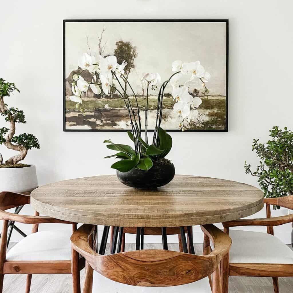 Round Dining Table With Orchid Centerpiece