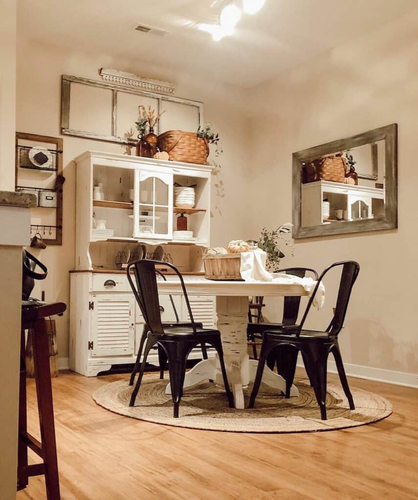 Round Dining White Table Paired With a Round Jute Rug