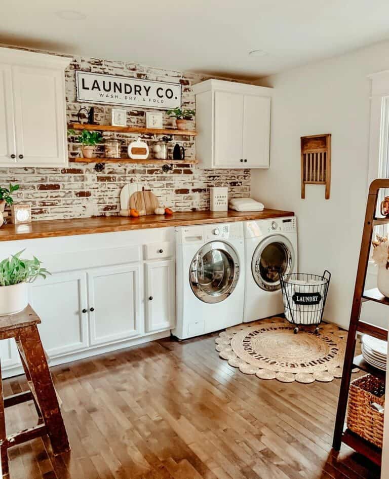 Rustic Laundry Room With White Cabinets