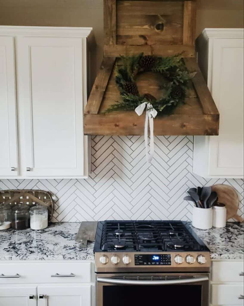 Rustic Range Hood With White Herringbone Subway Tile