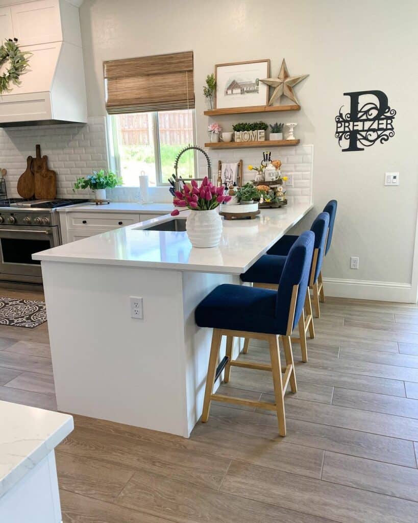 Rustic White Tile Backsplash and Tall Blue Chairs