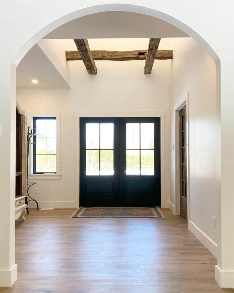 Rustic Wood Ceiling Beams on White Entryway Walls