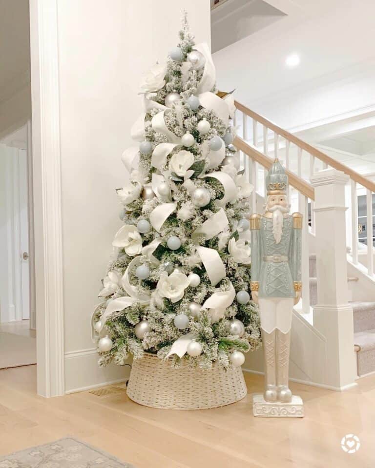 Silver and White Frosted Tree with Christmas Nutcracker