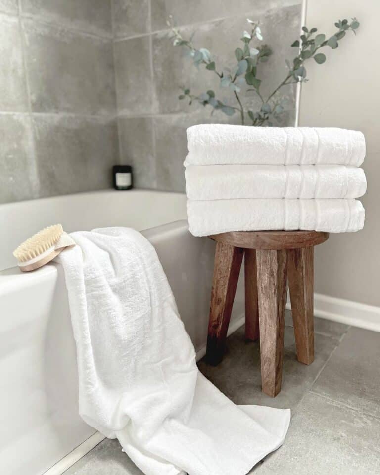 Small Wooden Bathroom Stool With White Towels