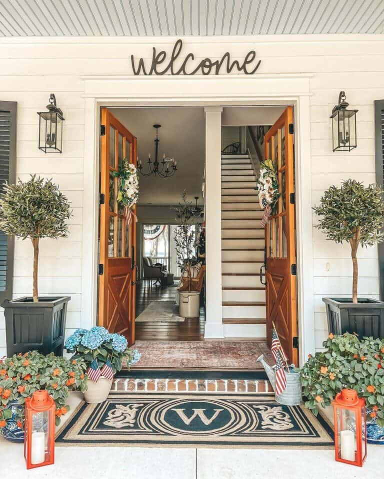 Stained Wood Double Doors with White Flower Wreaths