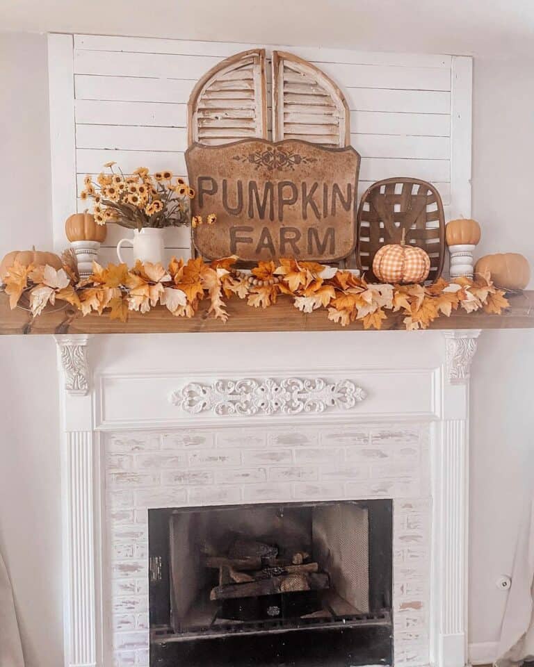Stained Wood Fireplace Mantel with Fall Garland
