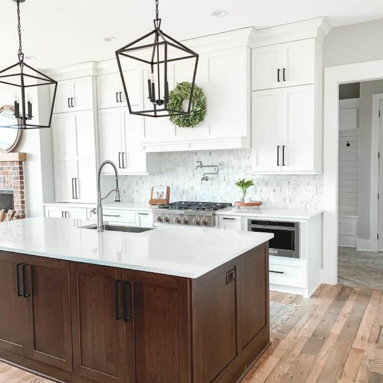 Stained Wood Kitchen Island With Black Pendant Lighting