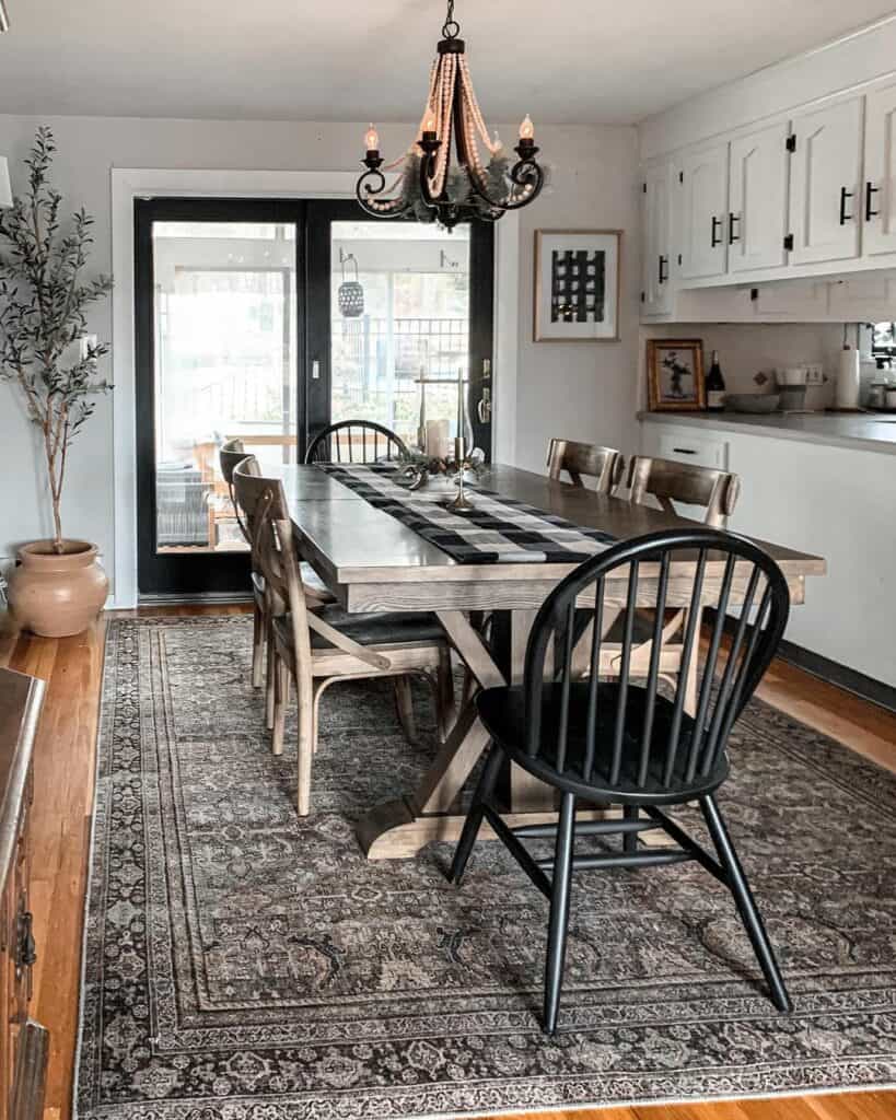 Stained Wood Kitchen Table With Black Spindle End Chairs