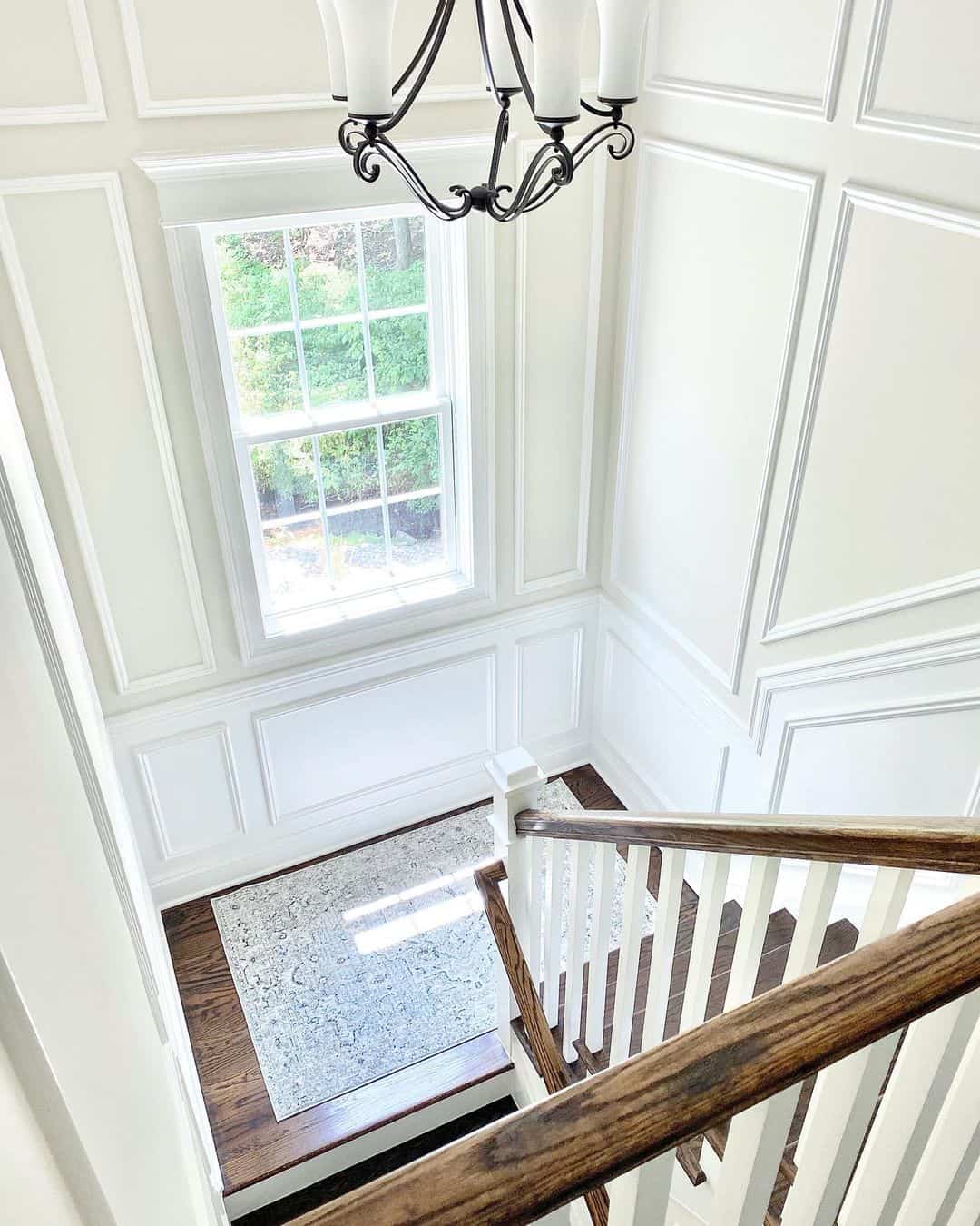 Staircase Landing with White Decorative Molding Soul & Lane