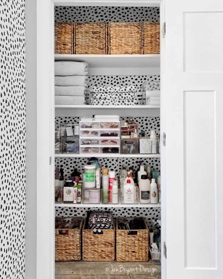 Striking Closet with Abstract Black and White Wallpaper
