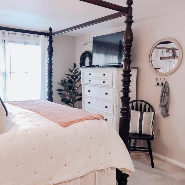 TV in Primary Bedroom With White Light Pink Wall