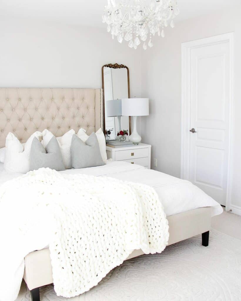 Thick White Knit Blanket Under a Glass Chandelier