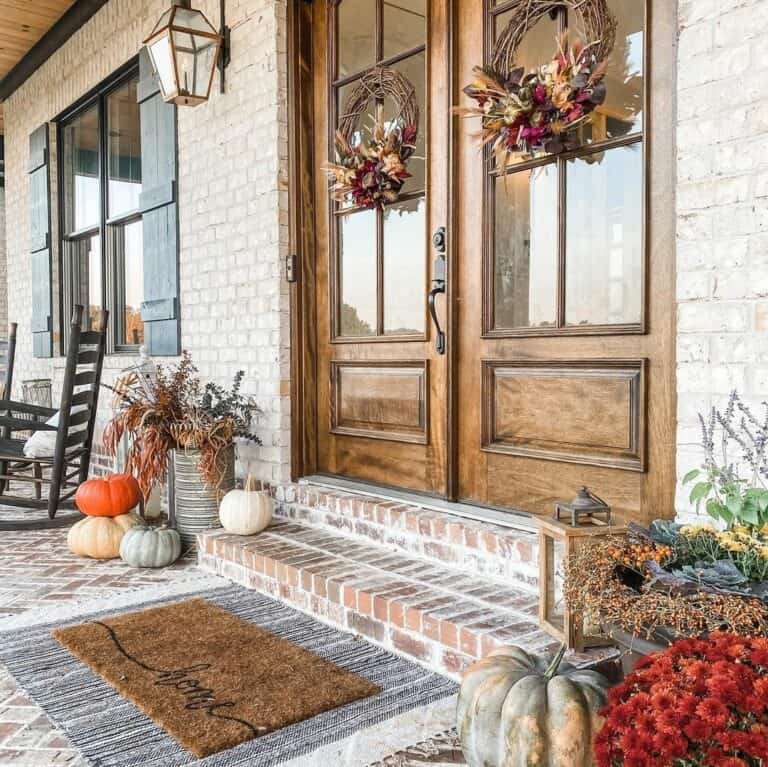 Two Brown Fall Wreaths on a Brick House