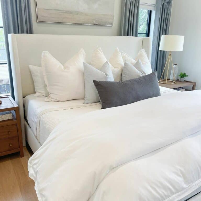 Upholstered Modern Bed in Front of Windows