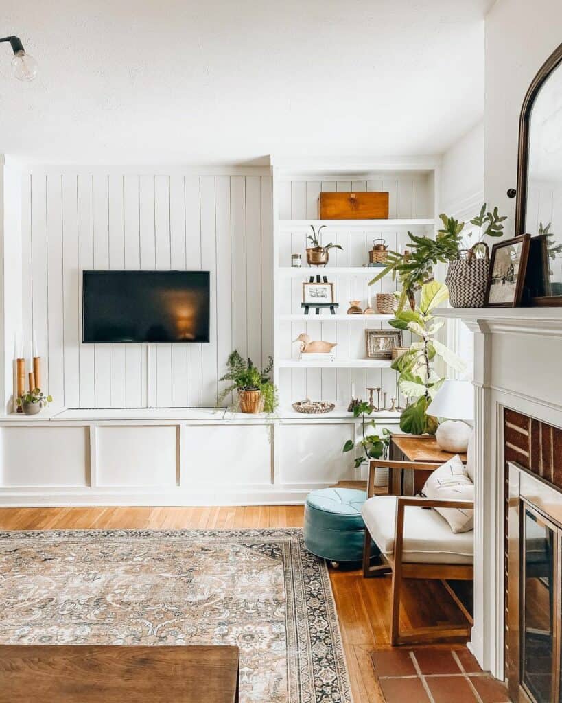 Vertical White Shiplap TV Wall with White Floating Shelves