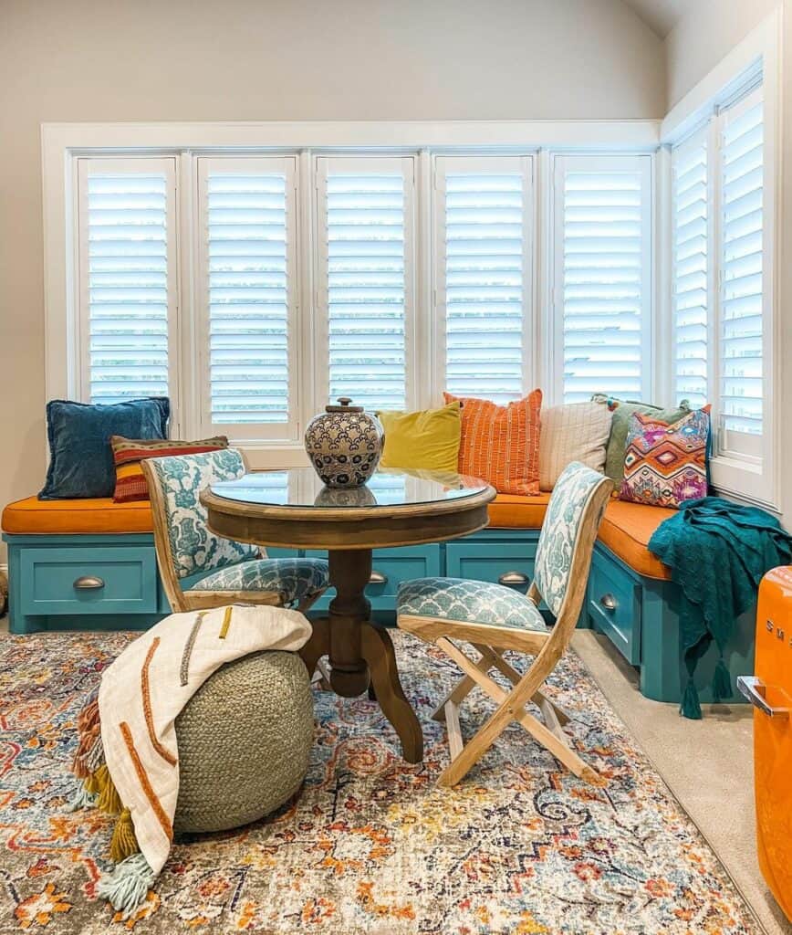 Vibrant Orange Cushion on a Blue Corner Bench With Storage