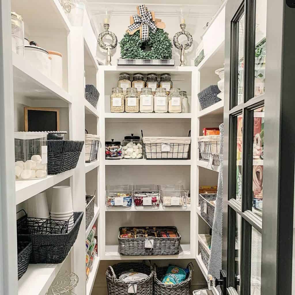 Walk-In Pantry with Glass Canisters and Black Baskets