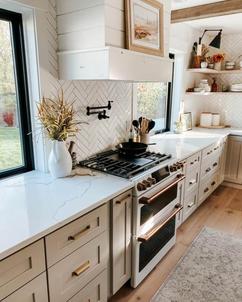 Warm Grey Kitchen Cabinets with Brass Hardware