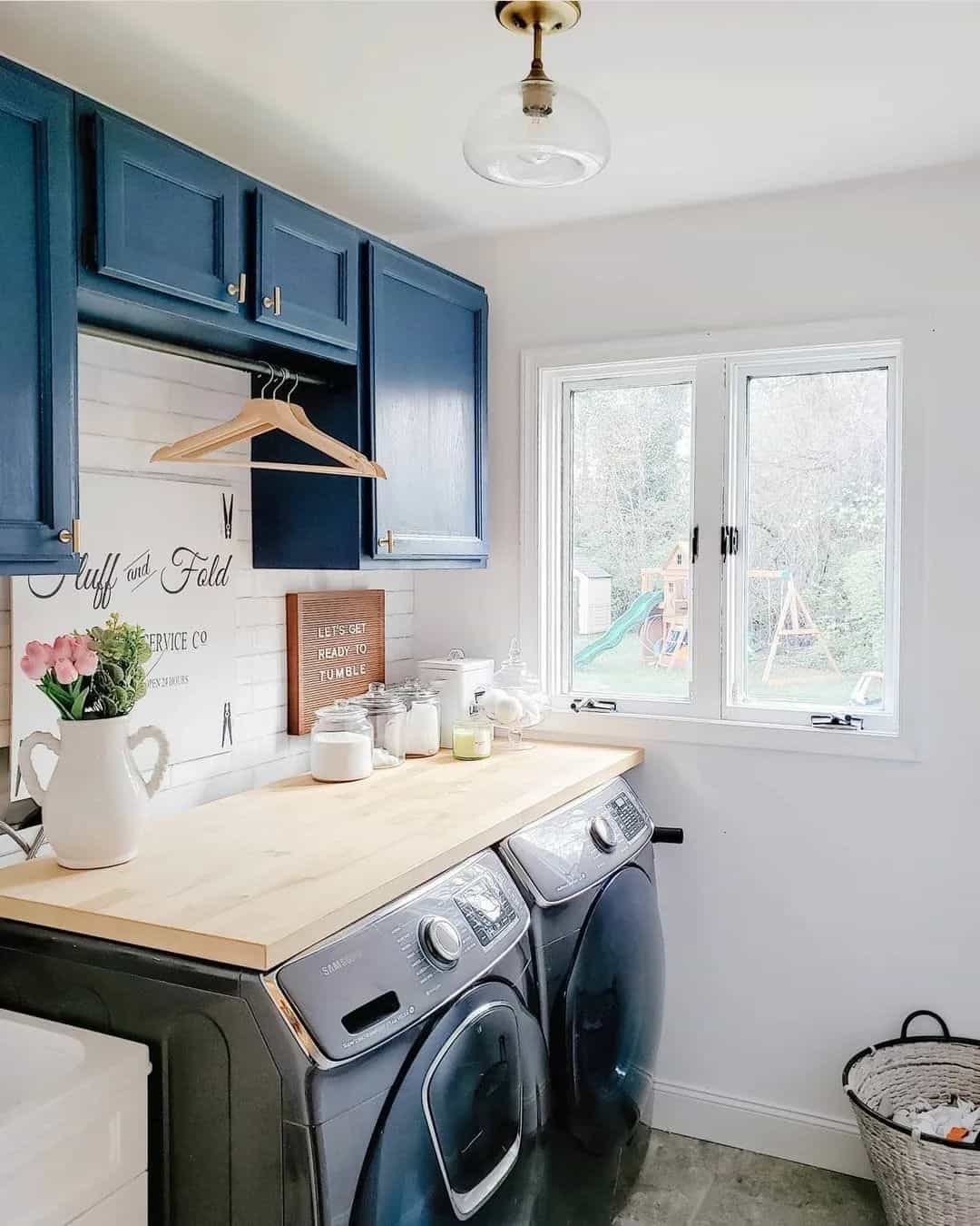 Warm Laundry Room With Navy Blue Cabinets - Soul & Lane