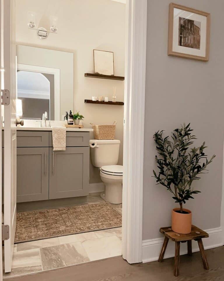 White Bathroom With a Grey Vanity and Neutral Décor