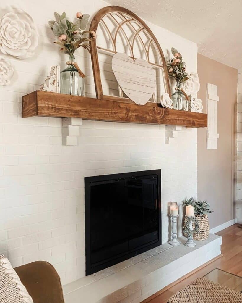 White Brick Fireplace With Wood Décor