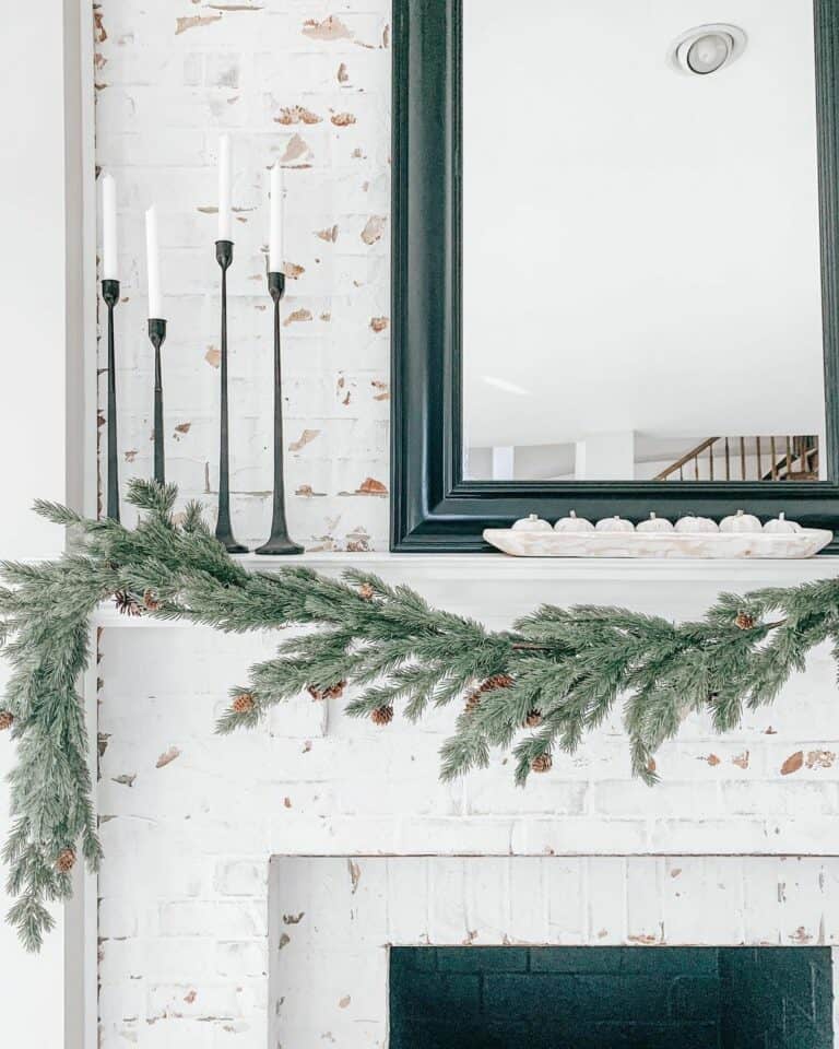 White Brick Fireplace with Christmas Garland on Mantel