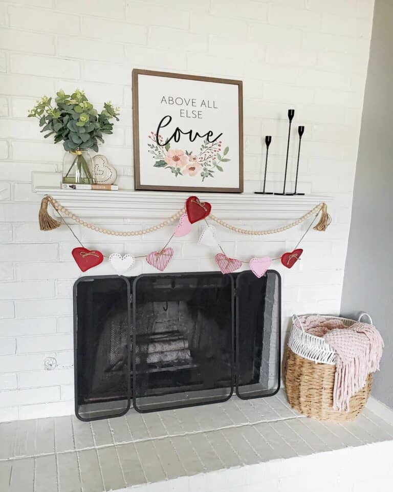 White Fireplace Mantel With Heart Garland