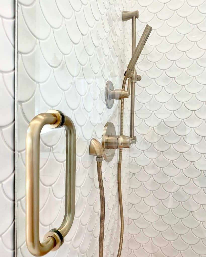 White Fish Scale Tiles and a Brushed Bronze Showerhead